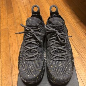 Nike KD 11 Black with gold splatter.